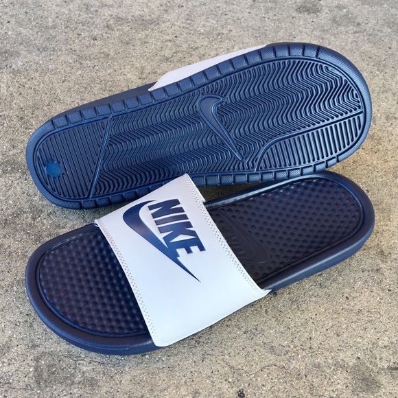 blue and grey nike slides